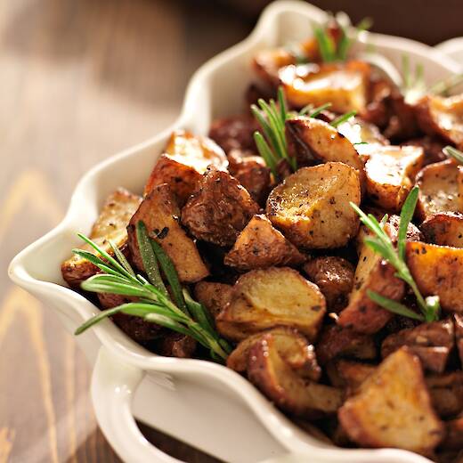 Crisply fried frozen potatoes in a bowl.