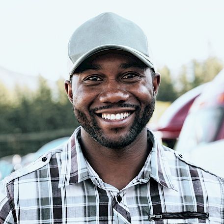 A truck driver smiling